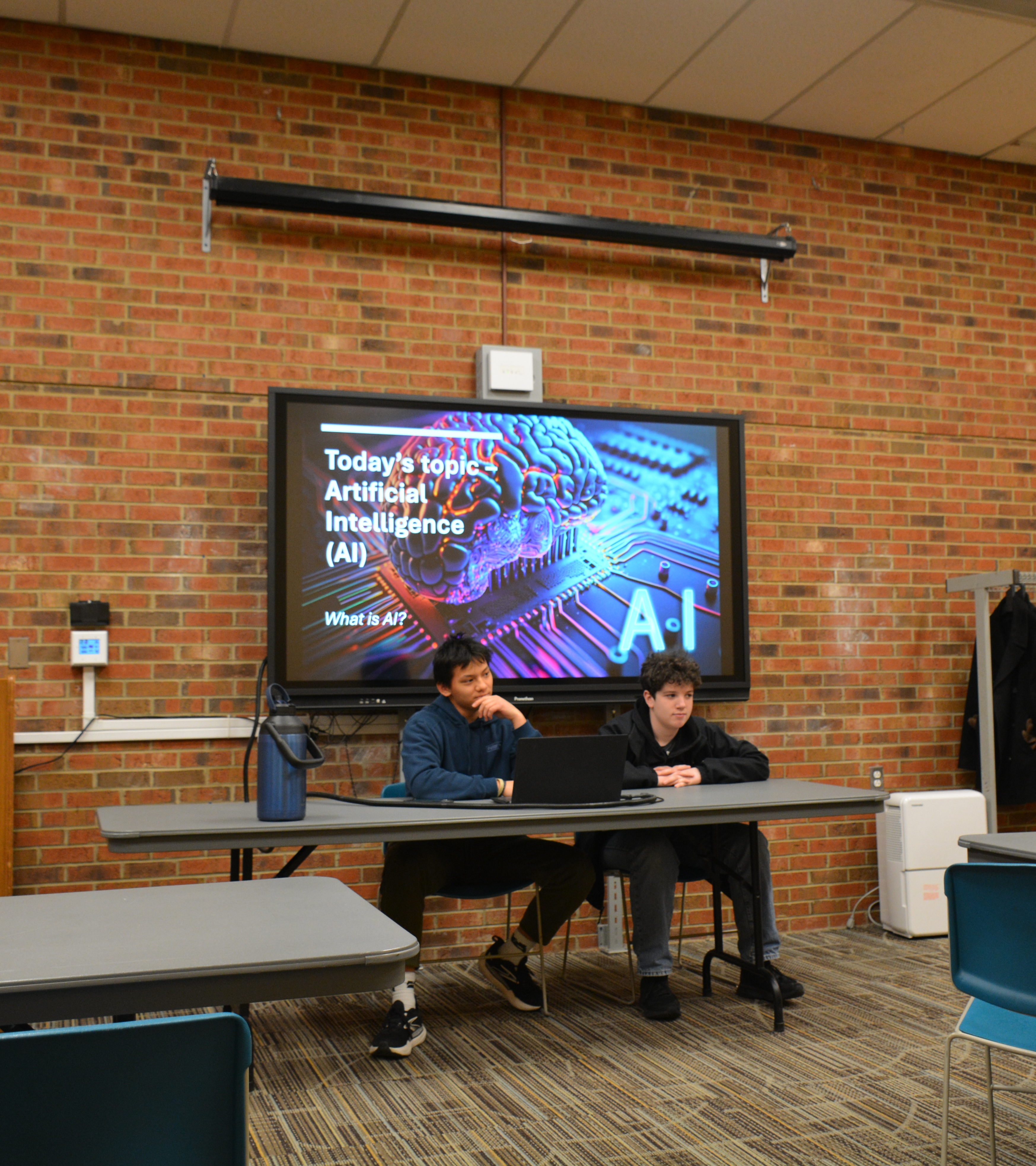 Students exploring artificial intelligence concepts in a workshop